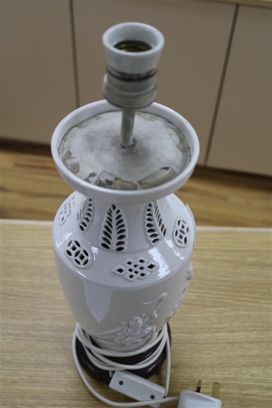 A Chinese figural whiteware lamp on wooden base